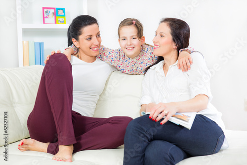 Tableau sur toile Young beautiful mother her little daughter and  aunt