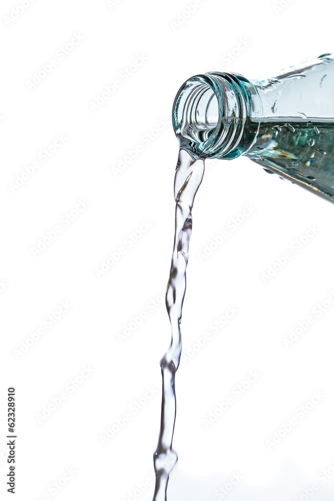 Glass bottle pouring water isolated on white Glass bottle pouring water isolated on white