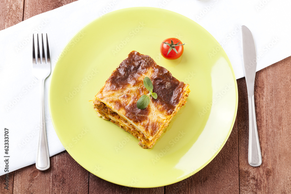 Portion of tasty lasagna on a plate Portion of tasty lasagna on a plate