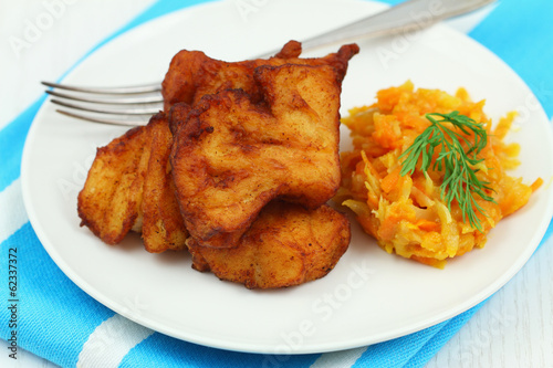 Fried cod with vegetables, close up