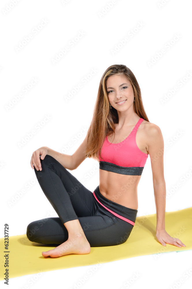 Young woman doing yoga on mat studio shot Young woman doing yoga on mat studio shot