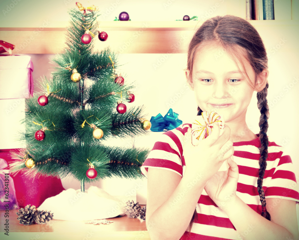 child with a Christmas gift child with a Christmas gift
