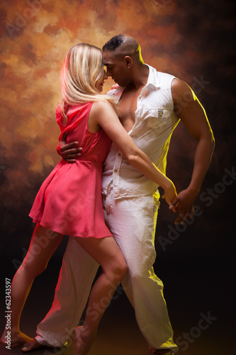 Young couple dances Caribbean Salsa