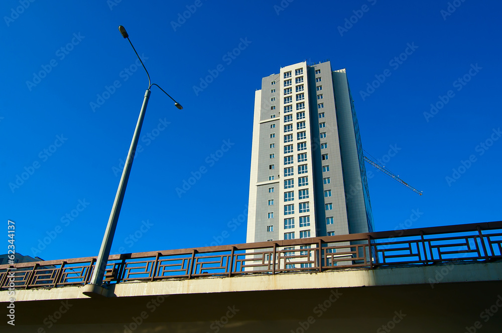 Single house and single lamp directed to the blue sky. Single house and single lamp directed to the blue sky.