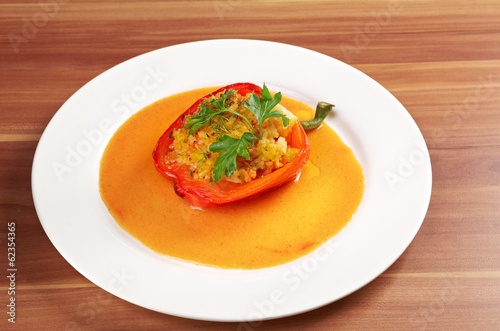 Plate with baked stuffed peppers.