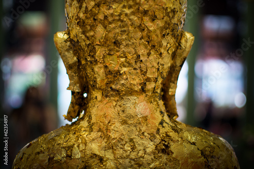 Buddha with Gold leaf in back view photo