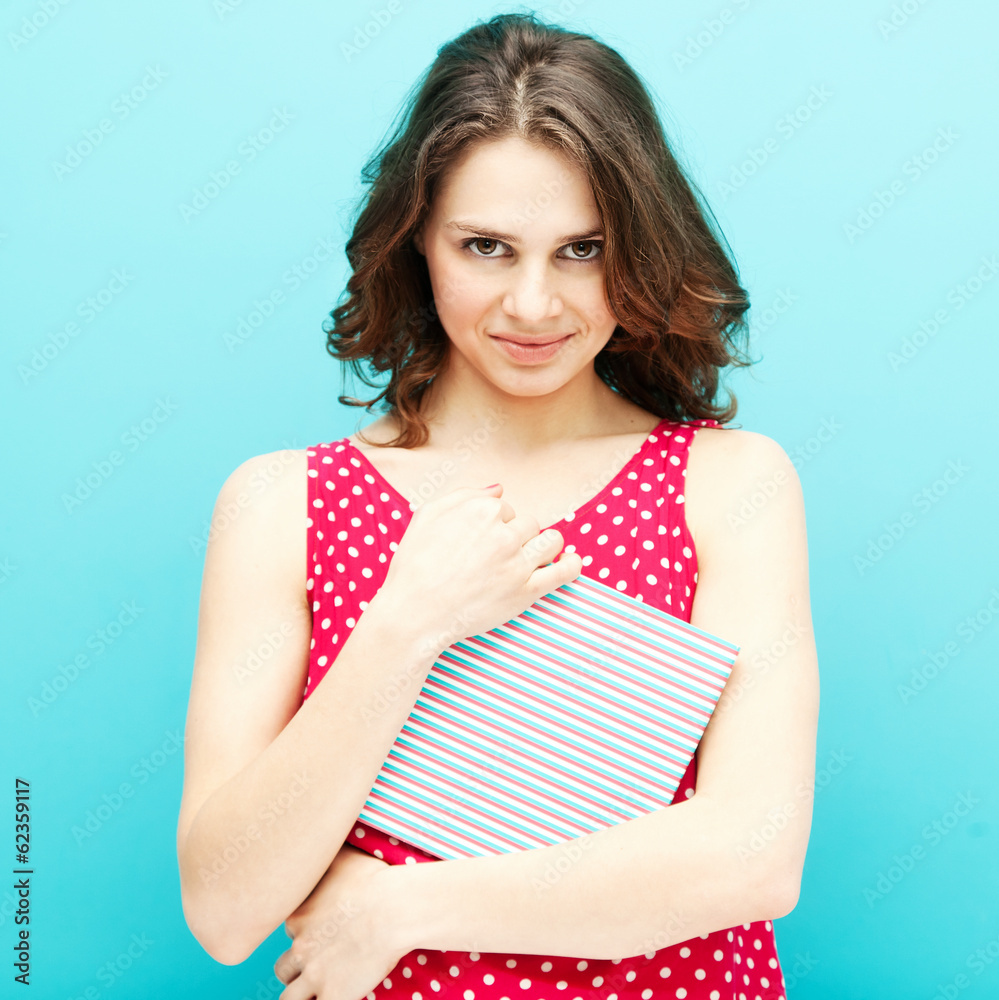 beautiful girl in a red polka dot blouse with a diary beautiful girl in a red polka dot blouse with a diary