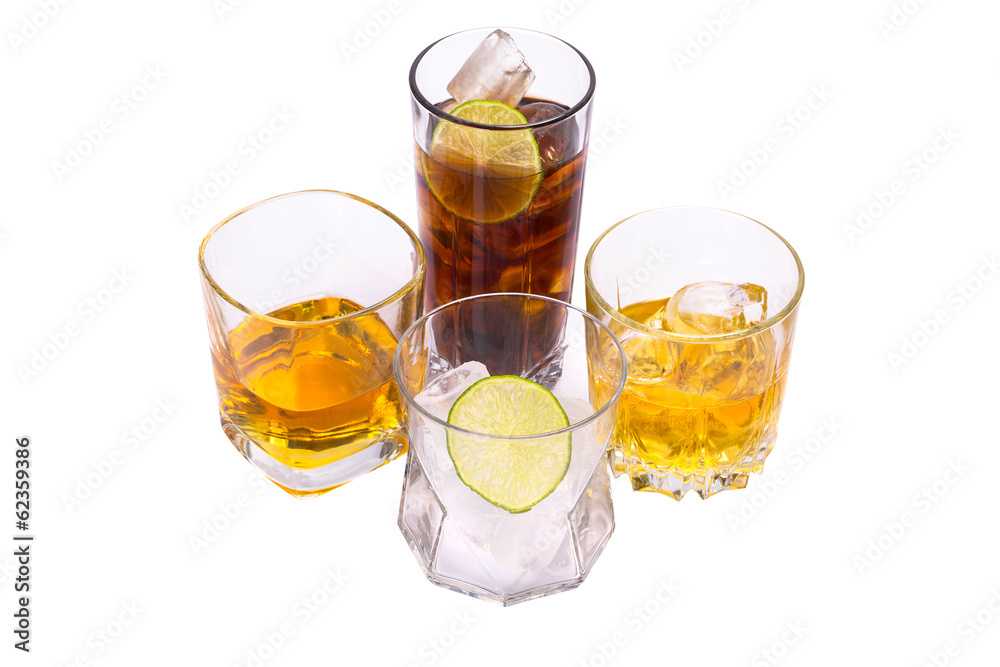 Selection of whiskey on ice over white background Selection of whiskey on ice over white background