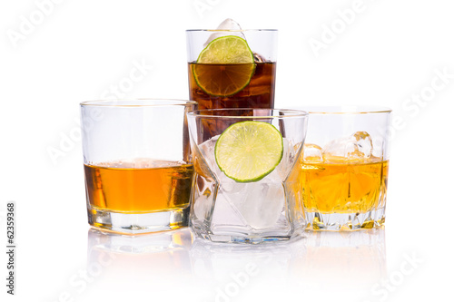 Selection of whiskey on ice over white background