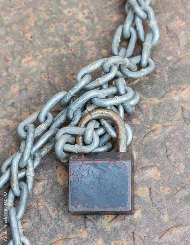Black lock chain fastens metal industrial box