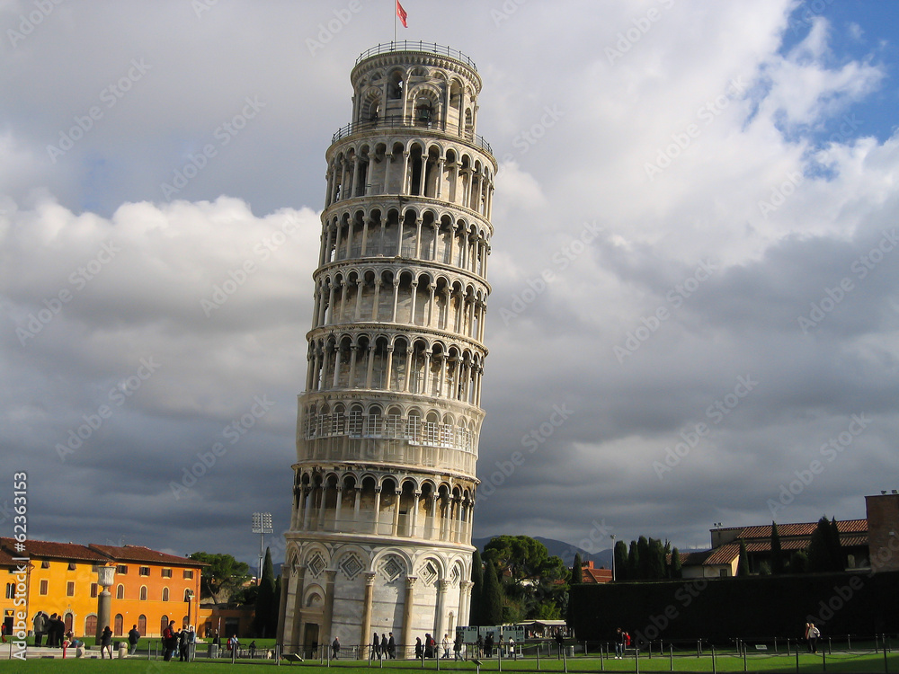 The famous Leaning Tower in Pisa on cloudy sky background