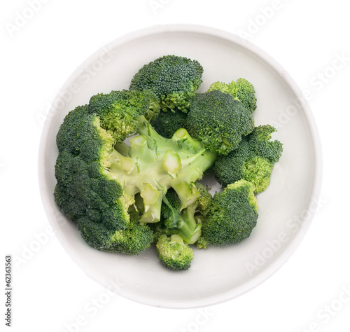 broccoli head  in white  bowl   isolated
