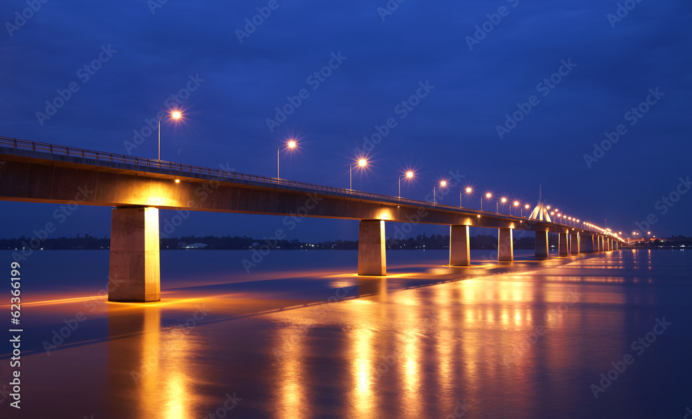 concrete bridge and river in twilight