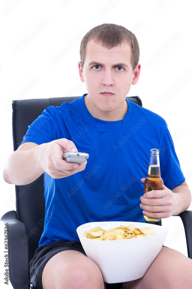 young man watching tv and changing channels with remote control young man watching tv and changing channels with remote control