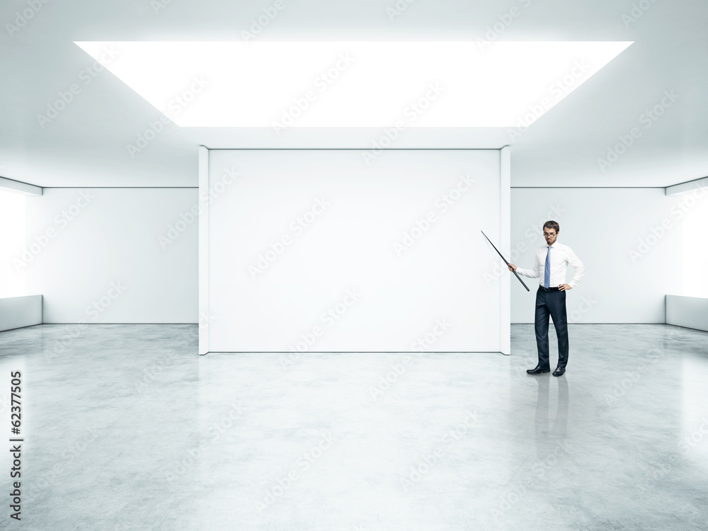businessman standing in bright office businessman standing in bright office