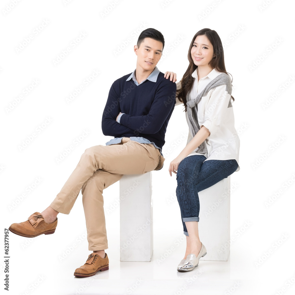 Portrait of young Asian couple sit