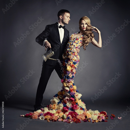Young man and beautiful lady in flower dress