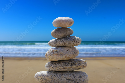 zen balance stone on the beach 6