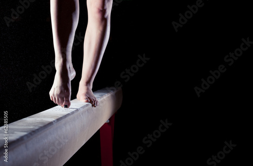 Canvas Print feet of gymnast on balance beam