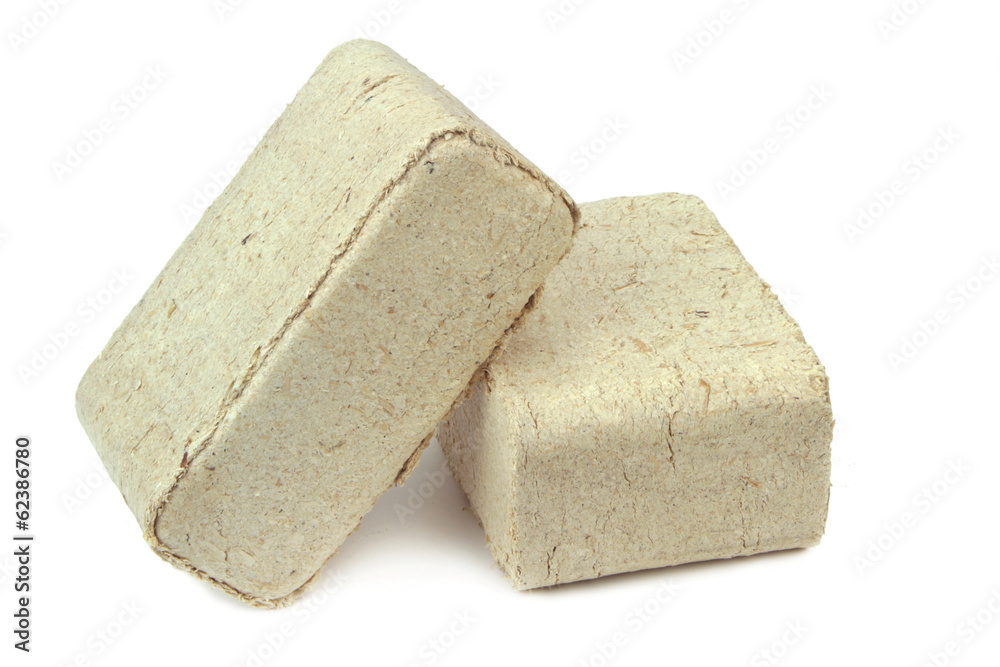 Pressed sawdust, wood briquettes isolated on white background.