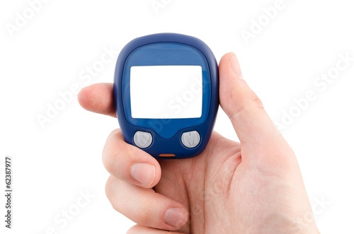 Hand holding glucometer with blank display isolated on white bac
