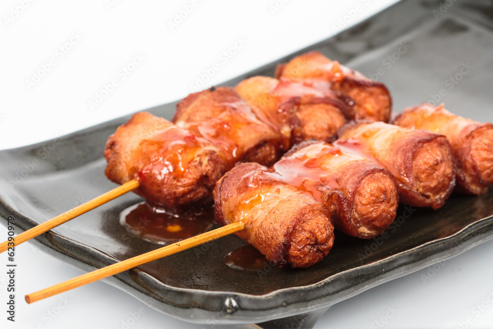 fried sausage rolled with bacon