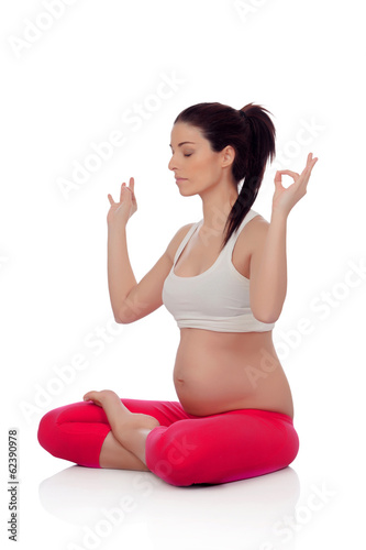 Beautiful pregnant woman doing yoga