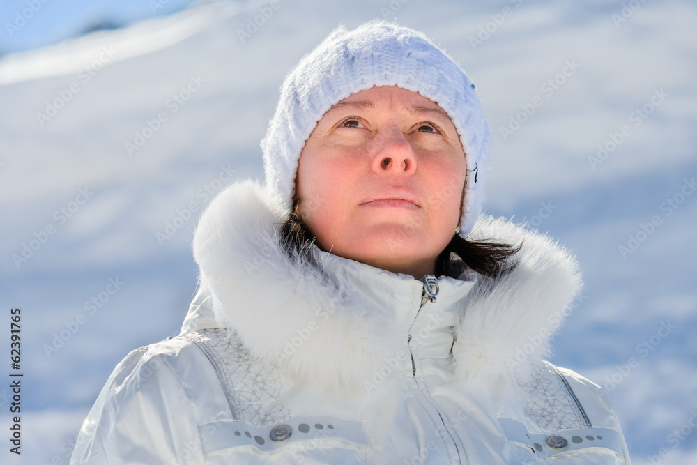woman in ski suit on a background of mountains woman in ski suit on a background of mountains