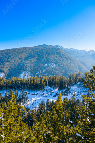 Mountain landscape in sunny winter frosty blue clear sky.