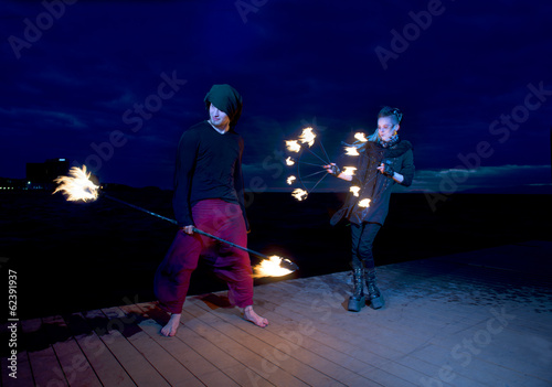 Fire show with fire-juggling