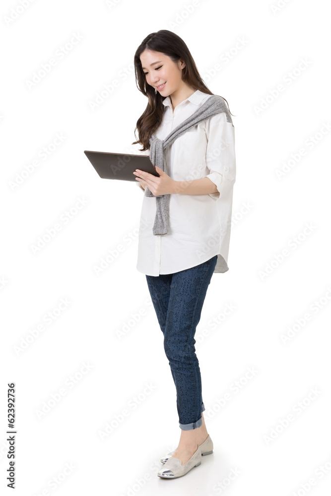 Attractive young Asian woman using pad Attractive young Asian woman using pad