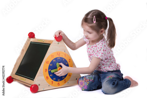 Wallpaper Mural Girl studying while on toy hours sitting on the floor, on white Torontodigital.ca