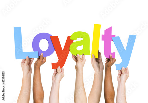Multi Ethnic People Holding The Word Loyalty