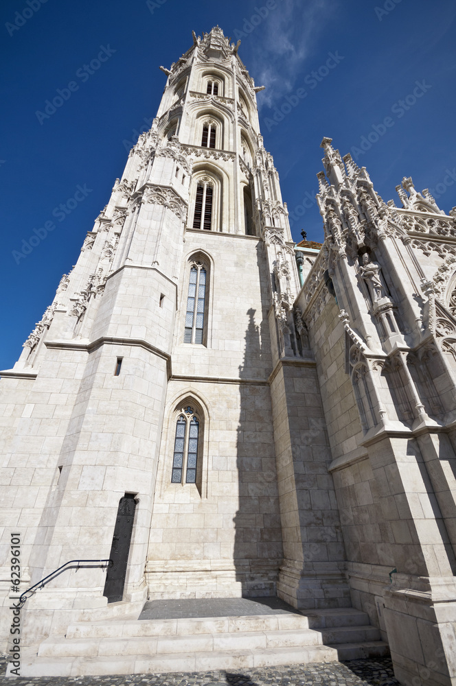 Matthias Church tower Budapest low angle view with blue sky Matthias Church tower Budapest low angle view with blue sky