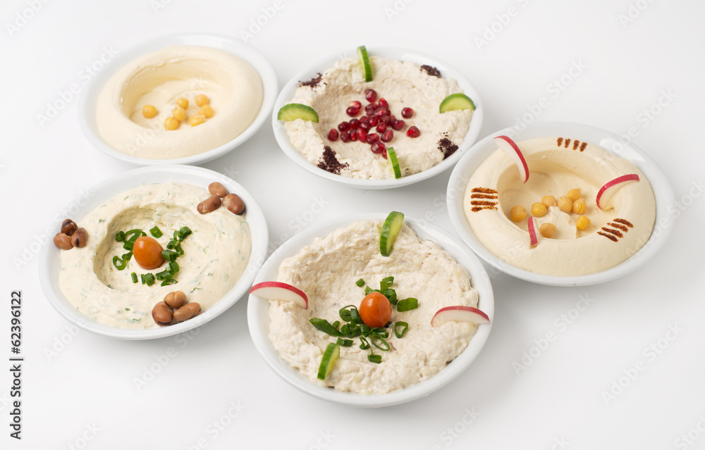 Arabic traditional Hummus Plates with different toppings Arabic traditional Hummus Plates with different toppings