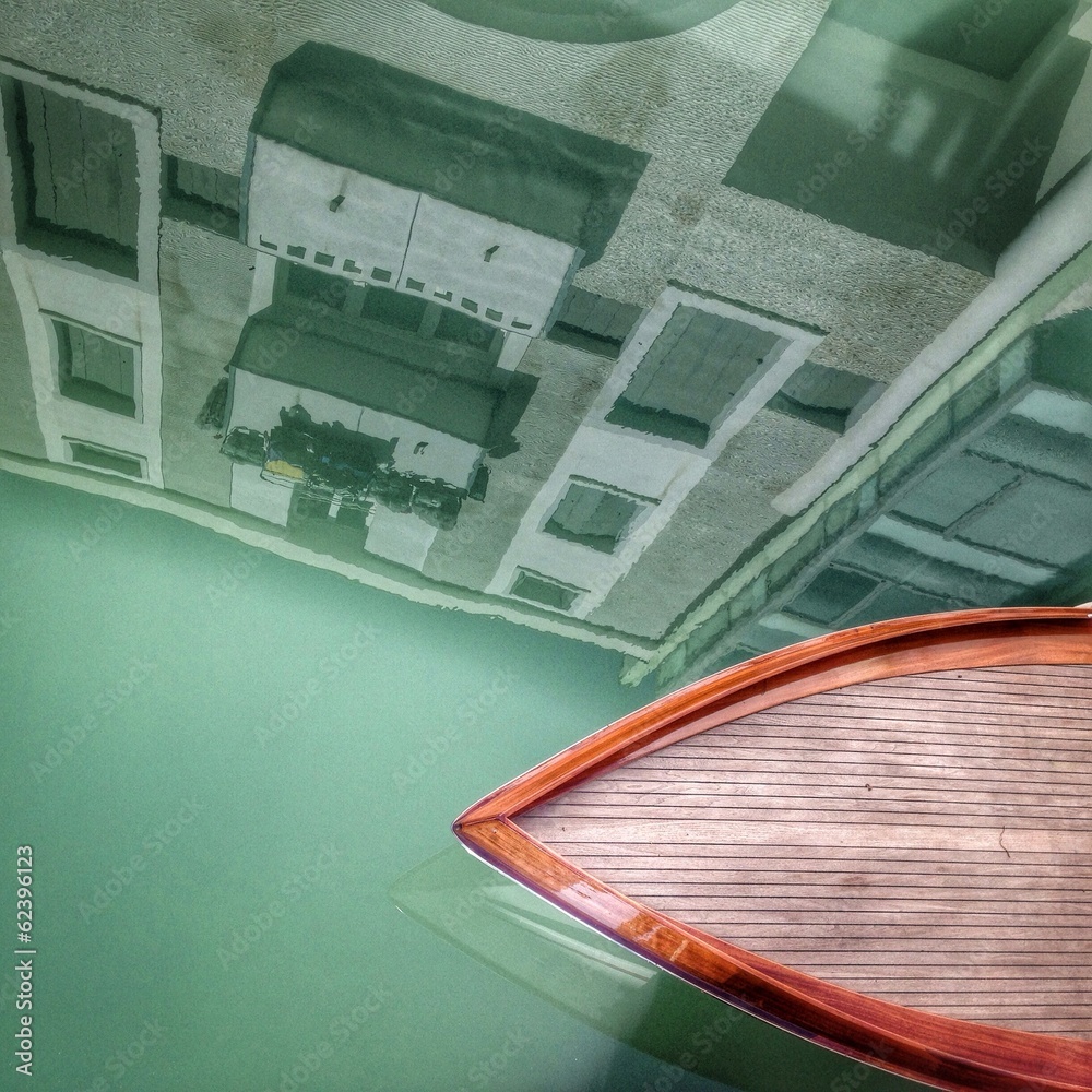 Obraz premium Venice, a wooden boat in a canal