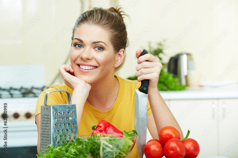 Young happy woman cooking