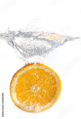 dropped orange in water isolated