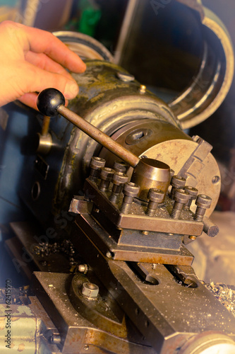 Metallurgist working on lathe