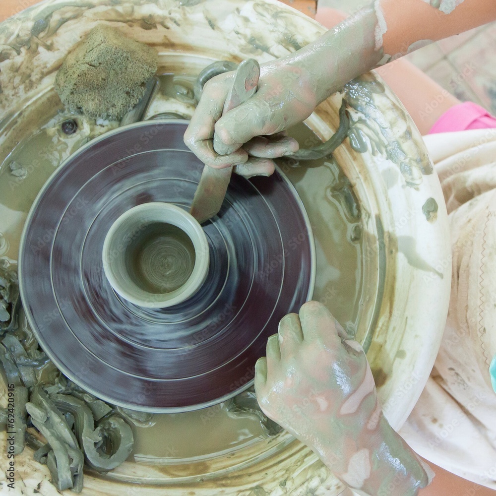 Fototapeta premium Process of making potter on a potter's wheel