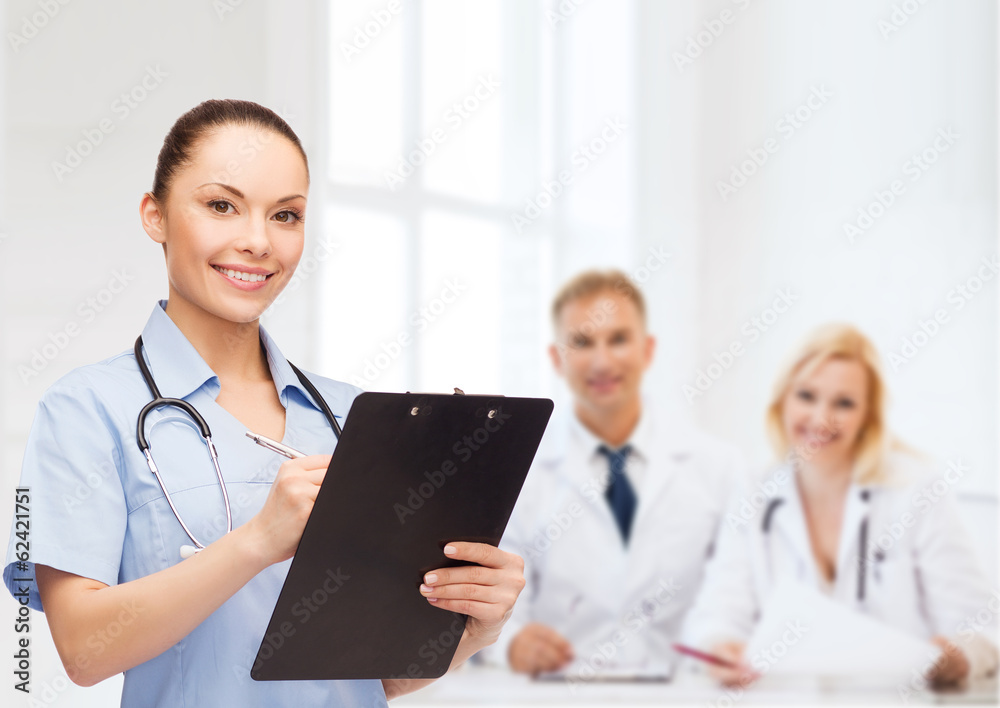 smiling female doctor or nurse with stethoscope smiling female doctor or nurse with stethoscope