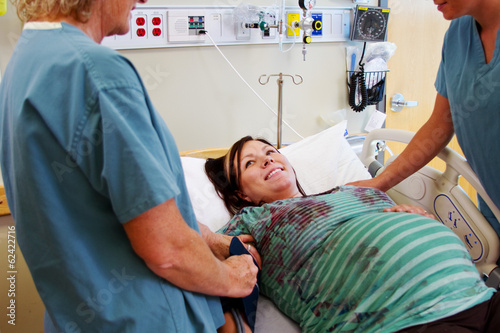 Nurses checking maternity patient