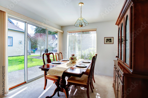 Elegant dining room with a walkout deck