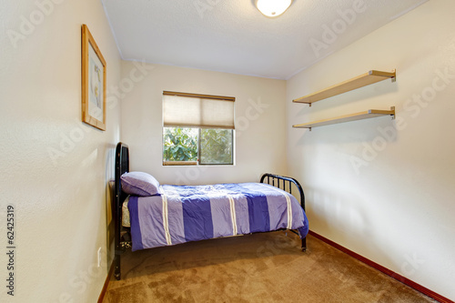 Small rectagle bedroom with an old metal frame bed