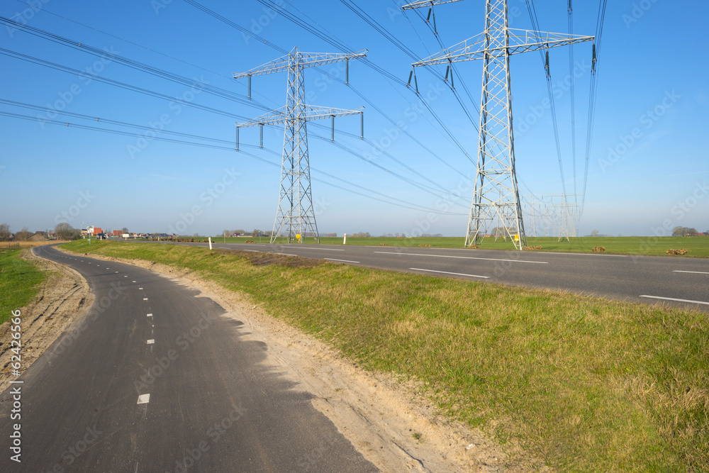 Power line in the countryside under a clear sky Power line in the countryside under a clear sky