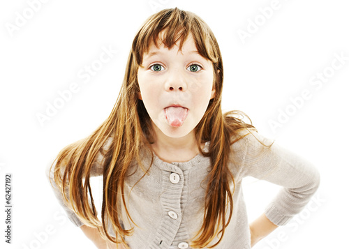 Little girl showing the tongue on white background