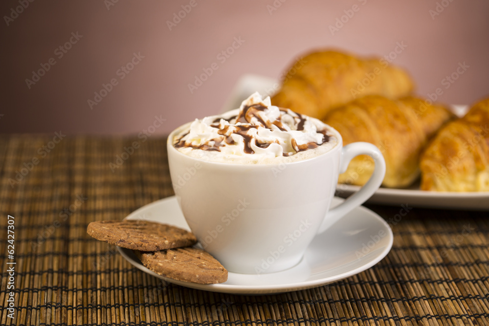 Coffee with whipped cream and croissant, donuts Coffee with whipped cream and croissant, donuts