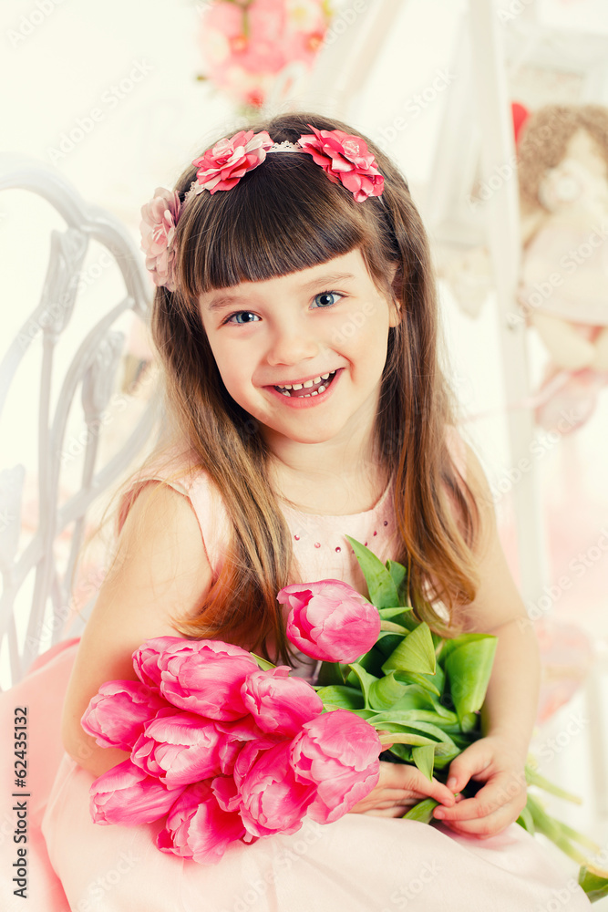Adorable little girl with bouquet of tulips Adorable little girl with bouquet of tulips