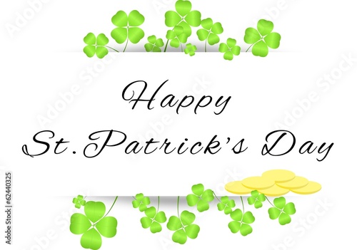 Board with greetings on St. Patrick's Day with four-leaf clovers