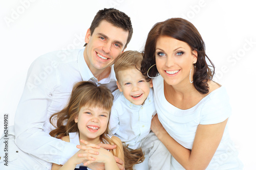 Beautiful happy family - isolated over a white background